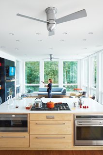 The New Zealand Native Who Can't Get Enough of the Garden State - Photo 4 of 9 - Modern Fan Company’s Cirrus Hugger models help the breeze along. She had low-level Sub-Zero and Wolf appliances as well as pop-up vents installed in the kitchen so there’s nothing at eye level.