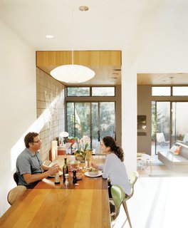 A Cherner Chair Retrospective - Photo 15 of 23 - Krubiner (here, with girlfriend Kylie Gordon) furnished the house with finds from Craigslist and eBay, such as the 1970s Milo Baughman dining table and Norman Cherner chairs.