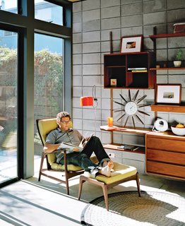 What Would Eichler Do? - Photo 6 of 8 - New Kid on the Block<br><br>Simpatico relies on the use of some site-built components, unusual in the prefab game. In the Krubiner house, the walls in the garage and the living room are made from insulated concrete from Omni Block. Providing both aesthetic and practical benefits, block walls work well for exterior or interior walls that don’t require plumbing and heating. They’re also cost-effective, as they can be built on a slab, rather than a foundation, and don’t require exterior siding or interior drywall.<br><br>Raise the Roof<br><br>To incorporate what Swatt calls "a dimension of space you don’t often associate with modular construction," Simpatico’s factory-built pieces come in two ceiling heights: nine or ten feet. Just above the ceiling, the customization continues—Simpatico modules can be designed to house green roofs, which boost insulation, absorb rainwater, and reduce runoff. In fact, the prototype makes use of all the rooftop spaces: Each one contains either a green roof, the 6.2-kilowatt solar-panel array, a roof deck, or terraces. "Every inch of the roof is doing double-duty," Krubiner says.