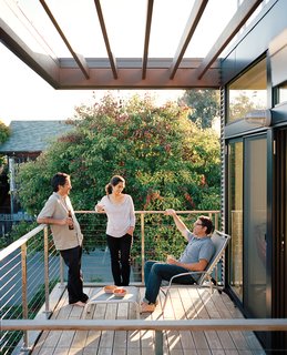 What Would Eichler Do? - Photo 7 of 8 - Good Sidings<br><br>"You don’t think of maintenance as a sustainability issue, but it is," says Swatt, who points out that most exteriors require stain, paint, or sealant for upkeep. This house instead boasts a zero-maintenance facade made from concrete block, corrugated metal, and Parklex—a siding material from a company based in Navarre, Spain. Parklex is an amber-colored wood, yet, because it is a thin veneer set in resin on top of an engineered panel core, it doesn’t require any scraping, painting, or sealing. If the siding ever does need cleaning, a pH-neutral soap-and-water solution and a mop will do the trick.
