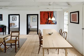 One of the few designer pieces in the home, a set of four Michael Thonet coffee house chairs,from 1859, offer a simple seating solution. The dining table, designed by Odgård, was built from a 109-year-old oak tree, which was harvested and milled locally.