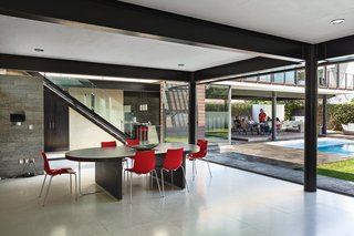 Chef Alfredo Oropeza wanted the kitchen to be the heart of the house. By saving money on building materials elsewhere in the project, Castillo was able to indulge in cabinetry by Porcelanosa, bar stools by Ligne Roset, and a granite island, making this the crème de la crème of kitchens.