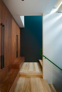 An Angular Futuristic House in Georgia - Photo 6 of 7 - One of the most challenging aspects of the build was incorporating the residents' request for a diverse material palette. The flooring is ash and the cabinetry is Mahogany. Cash Barnes custom fabricated the steel railing as well as the bridge and insect screens.