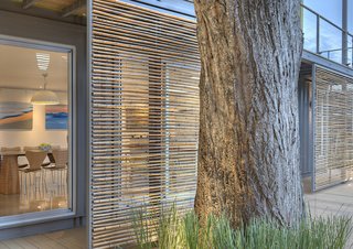 Who Knew a Relaxing Tropical Retreat Could Be Made of Shipping Containers? - Photo 8 of 10 - Sliding bamboo panels on the west side of the house can be adjusted to provide shade during the later part of the day.