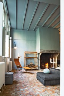 This House Proves Art Galleries Can Be Super-Friendly - Photo 1 of 18 - Wenes incorporated artful furnishings into the private spaces: In the living room, a leather chair by Maarten Van Severen is beneath a lamp by his son, Hannes Van Severen, of design duo Muller Van Severen.