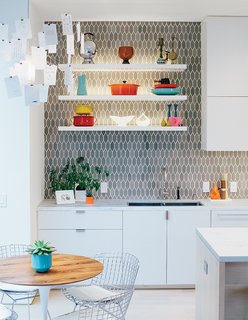 A Home with Eclectic Style Looks Just Right - Photo 2 of 19 - The space is just off the kitchen, which was moved and updated. Bradley paired cabinetry of his own design with tiles from Heath Ceramics.