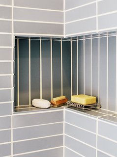 A Home with Eclectic Style Looks Just Right - Photo 13 of 19 - A shallow built-in bathroom shelf.