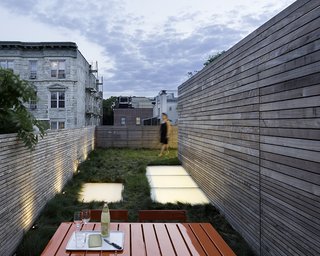 A rooftop oasis furthers the outdoor connection. It's planted with red fescue at the client's request for a wild and unmaintained look and an experience akin to "walking through a field."