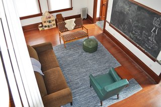 Living in a 1912 Schoolhouse - Photo 4 of 4 - The original chalkboard remains on the wall.