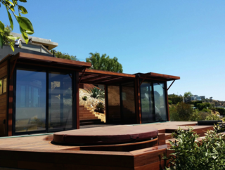 8 Companies That Are Revolutionizing Kit Homes - Photo 2 of 9 - kitHAUS prides itself on its stylish, modern prefabs that are built on-site by a team of company employees. Their patented aluminum system takes only a few days to construct, and the homes boast superior energy efficiency, owing to insulated floors, walls, and ceilings as well as glazed doors and windows.