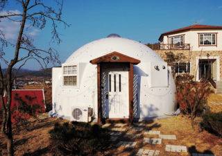 8 Companies That Are Revolutionizing Kit Homes - Photo 5 of 9 - Designed for the homeless and displaced, InterShelter domes are frameless structures made of high-tech aerospace composite material, providing strength and durability while allowing the structures to be easily disassembled and relocated. The materials for these domes can fit in the back of a truck, and are easily assembled in under four hours by two people. Once assembled, the structures are watertight, hurricane proof, and earthquake proof. They can even be combined into multi-structures, providing almost limitless possibilities as to size and design.