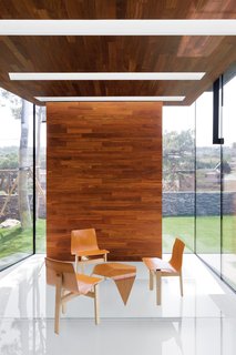 In the tearoom, Tre 3 chairs by Angelo Mangiarotti for AgapeCasa surround a Trienna table by Ilmari Tapiovaara for Artek.
