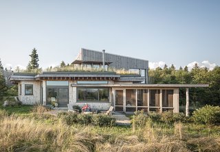 An Artist Builds a Wooden Home That Lets Nature Be the Boss - Photo 1 of 7 - Architect Will Winkelman and landscape architect Todd Richardson collaborated with a client, JT Bullitt, to design a house that blends into its surroundings in Steuben, Maine. The green roof gives the impression that "the ground just jumped onto the roof," Richardson says.