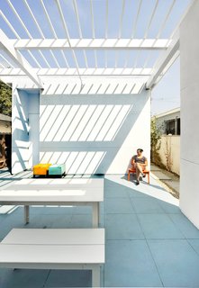 "Color simply and cost-effectively enriched and made the architectural idea palpable and pleasurable," Lehrer says about the prismatic theme. "It was used to explicitly articulate and dramatically enhance the circulation and spatial concepts. It helps make modest, but wonderful, spaces a little magical."