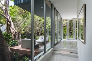 Thanks to floor-to-ceiling glass, the home feels like it's part of the landscape.