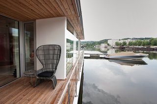 Floating Prefab Concept Rethinks the Houseboat - Photo 4 of 7 - "It’s oriented for the river," says architect Adam Jirkal. "It doesn’t have an engine. We wanted it to be as low to the water as possible, to really work with the water."