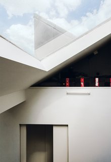 Skylights draw sunshine into the apartment.