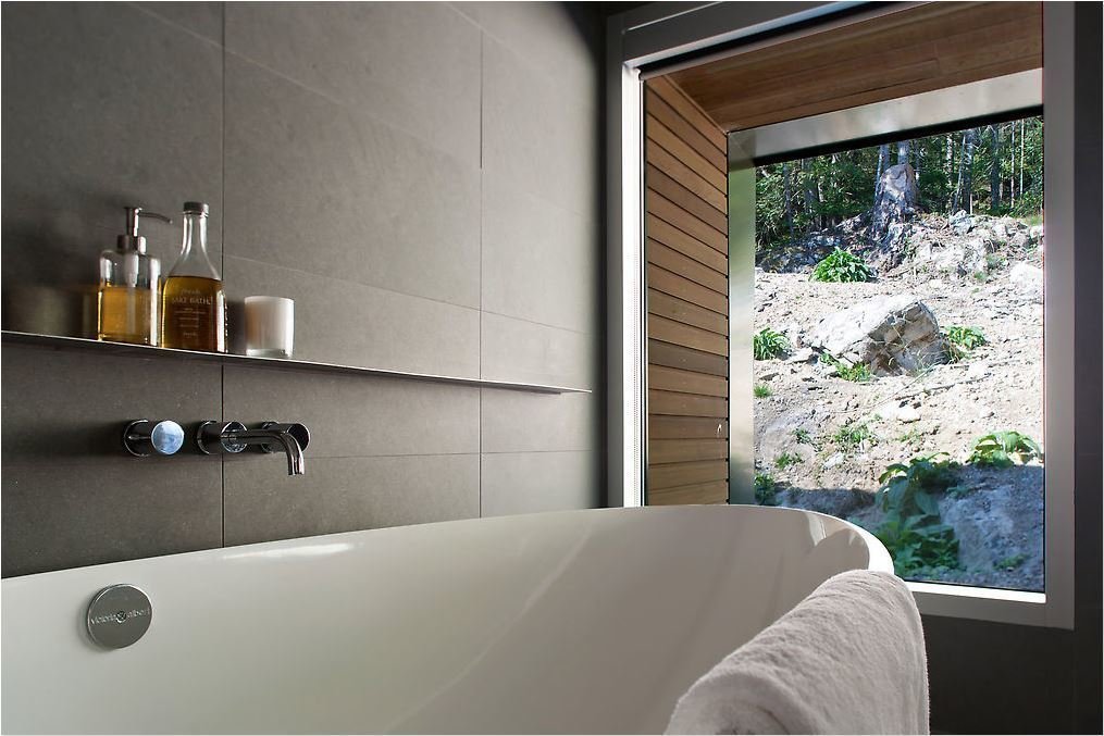 40 Modern Bathtubs That Soak In the View The bathroom was similarly designed to make the most of exterior views.