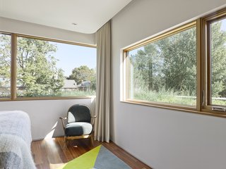 The structure has a 60/40 ratio of walls to windows, a figure that was achieved through computer modeling. "This ratio balances the amount of high R-value solid wall to glazing to create an overall building envelope for optimum thermal performance," Tedesco says. "This ratio was fine-tuned and tested using computer modeling that incorporated site-specific information such as building orientation, and the surrounding infrastructure such as neighboring houses and trees. The end result was an envelope design and window placement strategy that optimizes seasonal daylight cycles, maximizes solar gains in the winter, increases the level of interior natural daylighting, and considers views of the surrounding neighborhood." Because the residents are sensitive to noise, the walls feature extra insulaton, especially in the bedrooms and media rooms.