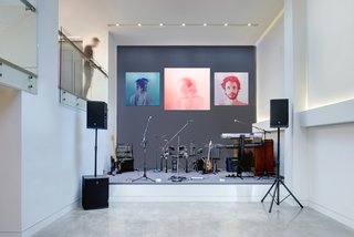 The owners host fundraising events throughout the year for a variety of local causes in the home’s public spaces. A double-height performance area is perfect for entertainment during these gatherings, during which local talent often performs. The artwork is by Jen Mann.