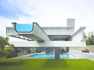The Acrobatic Wonders of Concrete - Photo 10 of 10 - In Madrid, a house constructed of seven distinct pieces of precast concrete beams worked together to create this residence by Spanish firm Ensamble Studio. The elements were repurposed from highway construction, with beams projecting out and functioning at times as both structural elements and programmatic elements like an infinity pool.