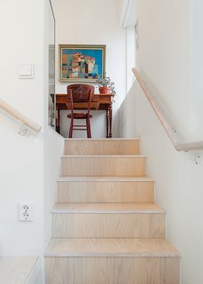 The flooring and stair risers are European ash, treated with a varnish that was tinted one percent white.