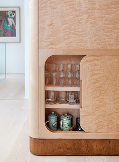 Salminen chose flame birch for the cabinetry for its remarkable wavy wood grain.