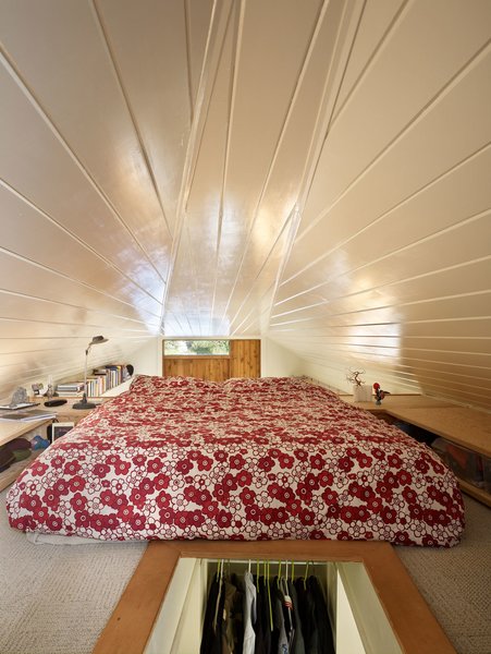 Tiny 1920s Garage Transformed Into a Charming Studio - Photo 8 of 8 - A triangular, open room beneath the gable roof provides a cozy space for sleeping. "The loft’s continuity increases the perceived size of the interior," Shaer says.