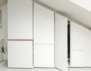 This Is How You Can Live Large in a Small Space - Photo 5 of 9 - Hynam built additional storage along one angled wall of the bedroom loft and beneath the skylight.