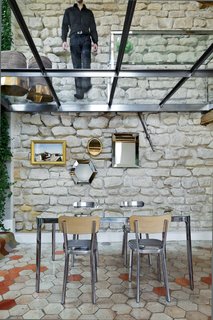 "At Rue Vignon I wanted to distort reality in order to create intriguing visions," explains architect Michael Herrman, who renovated an 18th-century structure in Paris for himself and his family. He was inspired by an apartment created in the 1930s by Le Corbusier.