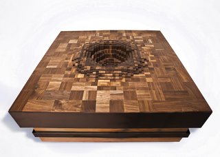 Part of the PIXEL series, the Ripple 2.0 Coffee Table, shown in walnut with powder coated steel pulls, takes the same inspiration of the movement created by a ripple of water and brings it to a different, slightly darker, place by using a different kind of wood and pixelating the motif further.