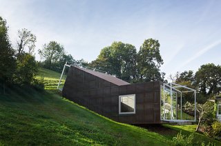 Architect Christian Tonko played with a double metaphor when designing the Camera Lucida studio. The name of the cantileverd hillside space, Latin for "bright chamber," references the open window facing the valley below, as well as the skylight that bathes the workspace in natural light.