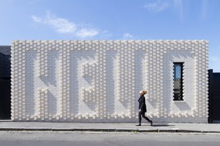 10 Homes With Distinctive Facades - Photo 6 of 10 - This Victorian-era home in Melbourne, renovated by OOF! Architecture, maintains privacy from the street, but does so in an unusually "friendly" manner—with a giant brick wall that spells out "Hello," a collaboration with local artist Rose Nolan. The residents wanted their house to appeal to passersby, since it sits on a well-trafficked block near a café.