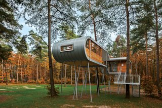 To reduce impact at the site, Baumraum prefabricated the house and craned it atop 19 steel columns, arranging it so that the surrounding trees’ roots wouldn’t be harmed. From within the structure, people experience a perspective that inspires more respect and consideration of the environment at large.