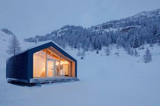 This Prefab Ski School in the Alps Took 10 Days to Assemble - Photo 6 of 7 - Girodo describes LEAPfactory’s architecture as being "molded according to the needs and stresses imposed by context." In this setting, strong winds and snow loads are serious concerns. The shell’s composite sandwich panels and aluminum shingles ensure that the school can withstand the elements.