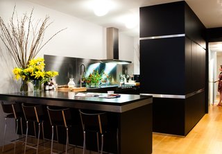 10 Stunning Ways to Use Black in Your Kitchen - Photo 10 of 10 - Arclinea's black cabinets with stainless-steel trim outfit the Manhattan kitchen of Dana Dramov.