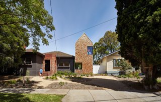 This Transformed Melbourne House Resembles a Quirky Village - Photo 2 of 11 - From the street, only the main house and one adjoining addition are visible, belying the spacious extension at the back. The architects call this the "Tardis effect," named for the time machine on Dr. Who that looks much smaller on the outside than it does within.