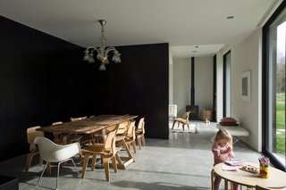 This Kid-Friendly Home is Full of Surprises - Photo 3 of 9 - The downstairs area is floored in polished concrete, and flanked on the north side by huge full-height windows through which passive heat is gathered. The majority of the winter heating, however, is from a ground source heat pump that uses the latent energy in the earth — a relatively new solution in New Zealand.