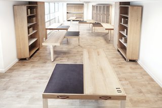 A Modular Meeting Room Features a Table with 6 Possible Layouts - Photo 3 of 6 - Each table is made from a mix of solid wood—embellished with carvings and pyrography—and leather.