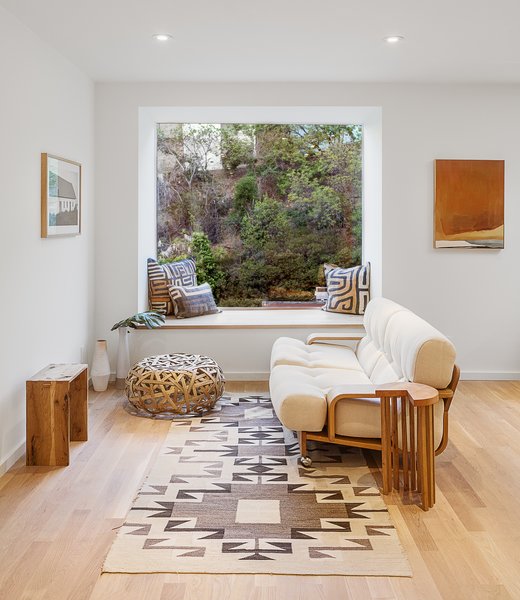 The lounge setup shows one of five "bump-outs" — in this case, it is used to provide additional seating without taking up floor space. In other parts of the house, the built-in seats also provide extra sleeping areas.