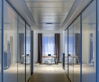 5 Architectural Tricks and Devices to Bring Natural Light Into Your Home - Photo 10 of 12 - In a home where transitional spaces like corridors and closets had no natural light, the use of white glass doors for the closets help bounce light and maximize light reflections.