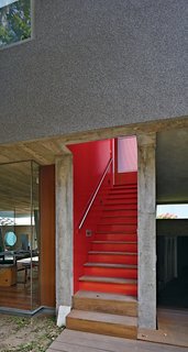 Given Lima’s dry climate, the architects were able to introduce clever indoor-outdoor gestures such as an open stairwell, and semicovered walkways that allow the trees to provide cover.