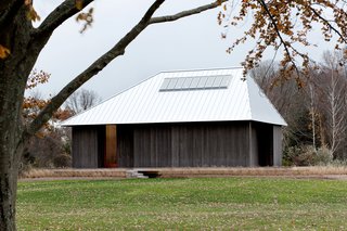 Guide to 7 Main Types of Roofs and What You Need to Know About Them - Photo 8 of 15 - The high pitch and asymmetrical shape of this standing seam metal hip roof by architecture firm P.R.O. gives it a distinct, dramatic appearance.