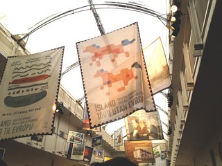 Banners fly high in the atrium of the Reykjavic Art Museum during the opening party, celebrating the Icelandic Contemporary Design IV series of postage stamps that were released this month. Photo by: Tiffany Orvet