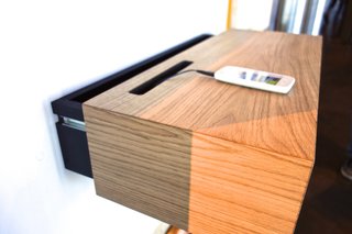 The Hleðsluskápur, or "Loading Dock Shelf" in English, came from the minimalist tendencies of architect Sverrir Ásgeirsson and product designer Stefán Pétur Sólveigarson. "I like to simplify everything," said Ásgeirsson. "We were trying to find a way to eliminate the jumble of cords you have and at the same time create a place in the entryway to put down your wallet and such." But the power strip needed to be accessible and stationary, turning a drawer into a unique design challenge. The "aha!" moment came when the designers realized they could reverse the drawer mechanism and slide the casing back and forth instead of the other way around. The Hleðsluskápur is made of oak wood and black mdf. Photo by: Tiffany Orvet