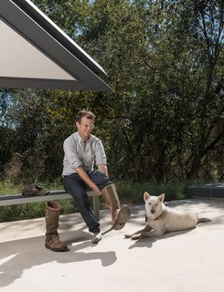 25 Dogs Living in the Modern World - Photo 13 of 25 - Home owner Chris Brown and his beloved dog Katsu get ready to take Dave on a tour of the Edgeland House land.