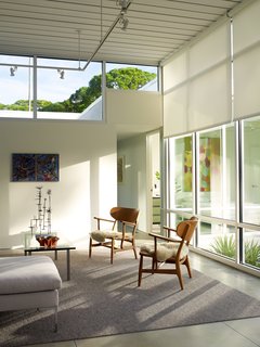Clerestory windows from YKK Commercial give the illusion that the roof hovers above the house—a key factor in keeping the light, modern touch that the homeowners desired. Epstein did not design the clerestories in a single, straight line; the glass drops down where possible to allow the maximum amount of light. It took a bit of convincing the sway his clients. "He said, 'Listen to me, stay with my concept, and you won't be sorry,'" Tetreault recalls. "So I stuck with it, and I'm not sorry."