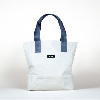 The Nonprofit That's Using Seat Belts and Super Bowl Banners to Fix Up Indianapolis - Photo 2 of 3 - The Archivist tote ($124) by People for Urban Progress is handmade from textiles recycled from Indianapolis infrastructure, including the roofing fabric of the RCA Dome.
