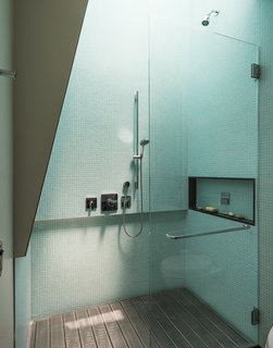 A Rooftop Garden Completes This Urban Pastoral Home - Photo 10 of 11 - The upstairs showers are particularly ingenious: Operable skylights loom above, and perforated, galvanized-steel platforms open up to spacious, sunken bathtubs.