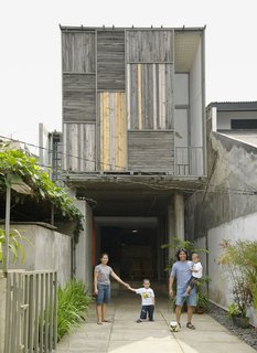 Photographer Q&A: Matthew Williams - Photo 6 of 7 - Nugroho Wisnu and his family outside their home in Jakarta shot for the June 2010 issue.